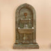 Monterosso Wall Fountain against brown background.