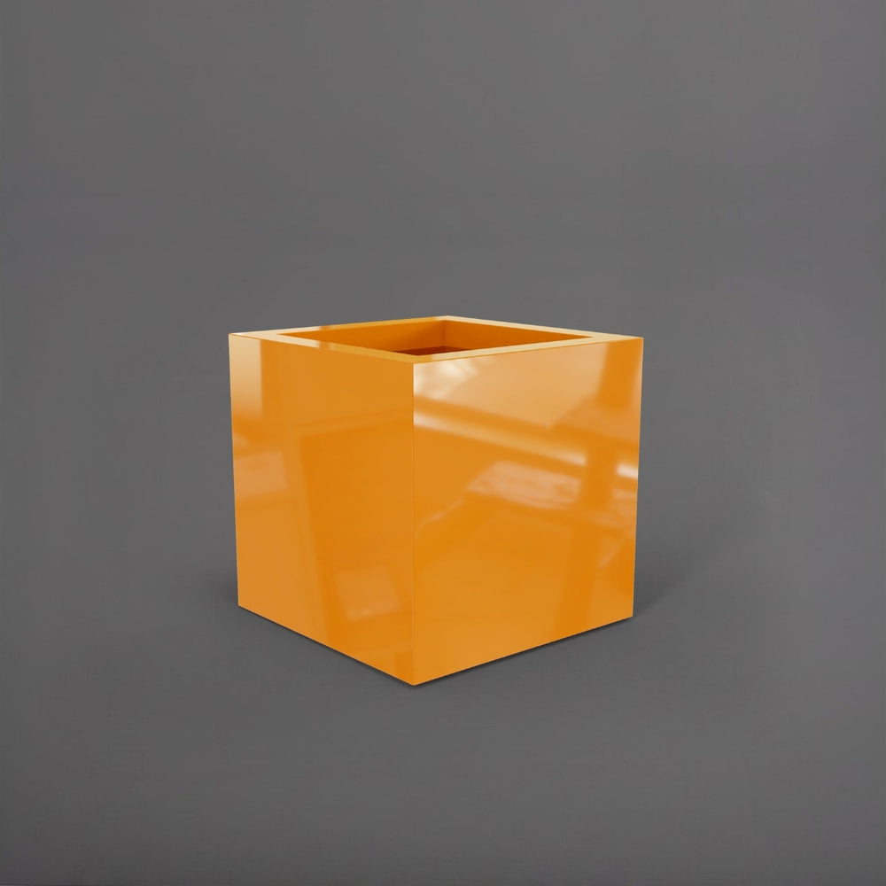 Montroy Cube Fiberglass Planter in gloss tangerine against gray background.