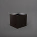 Montroy Cube Fiberglass Planter in matte charcoal against gray background.