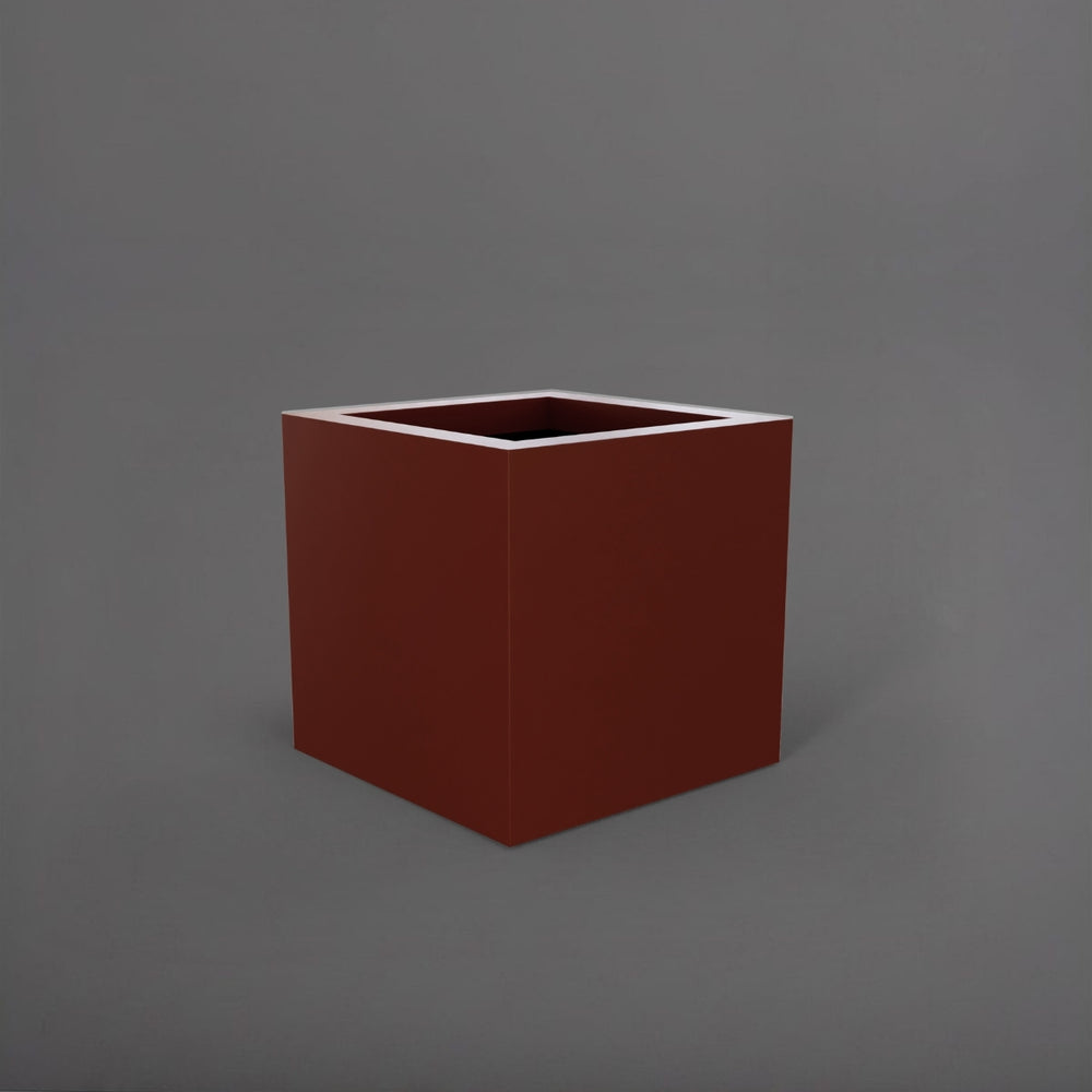 Montroy Cube Fiberglass Planter in matte terra cotta against gray background.