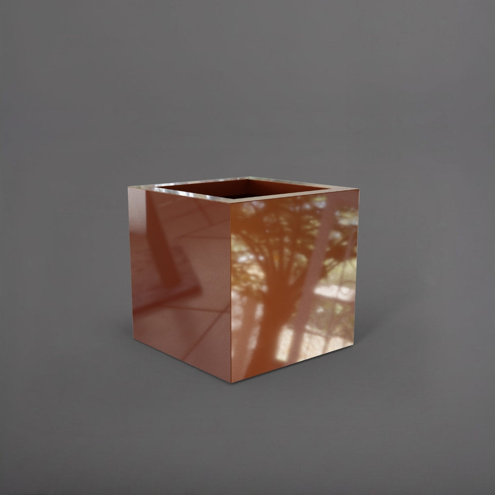 Montroy Cube Fiberglass Planter in  metallic bronze against gray background.