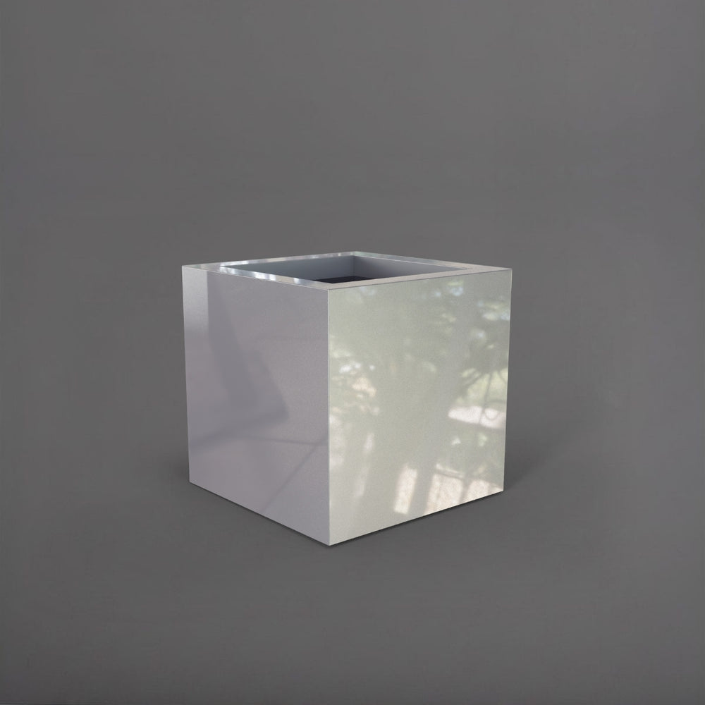 Montroy Cube Fiberglass Planter in  metallic silver against gray background.