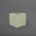 Montroy Cube Fiberglass Planter in satin beige against gray background.