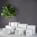 Montroy Cube Fiberglass Planter shown with different sizes filled with plants.