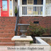 Mt. Airy Urn planter displayed on a stone pillar beside red brick steps at a front porch.