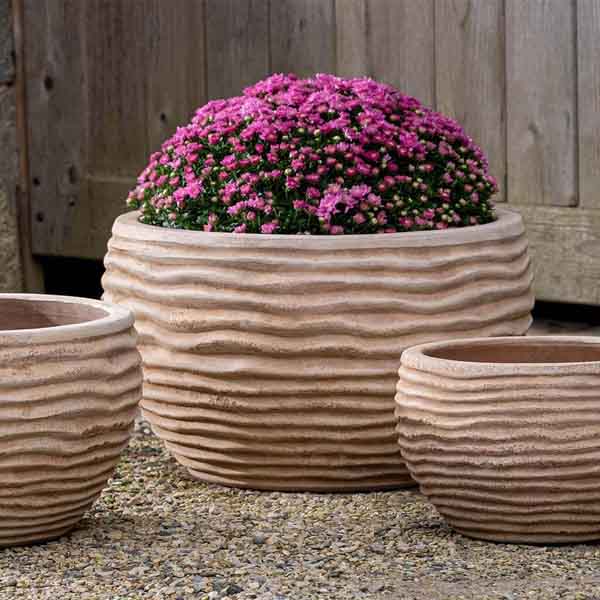 Nami Planter Antico Terra Cotta S/3 on the gravel with wood background