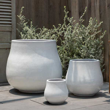 Nimbus Planter - Antique White - S/3 on concrete in the backyard