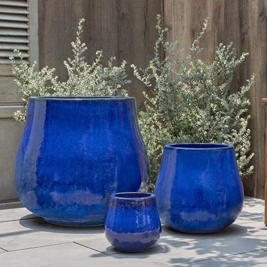 Nimbus Planter - Riviera Blue - S/3 on concrete in the backyard