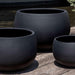 Norfolk Planter, Small in onyx black lite in the backyard