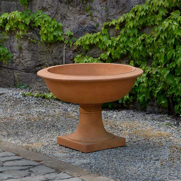 Notting Hill Urn on gravel in the backyard