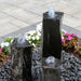 One Side Polished Basalt Fountain Kit on black pebbles in action