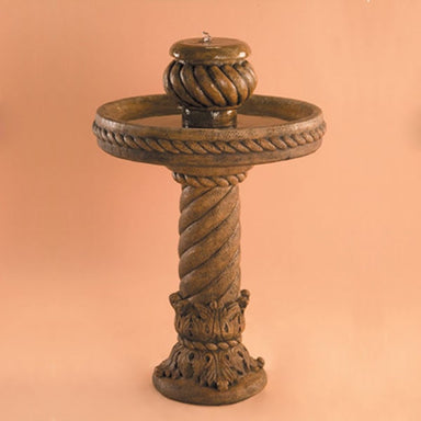 Ornate Swirl Fountain running against brown background