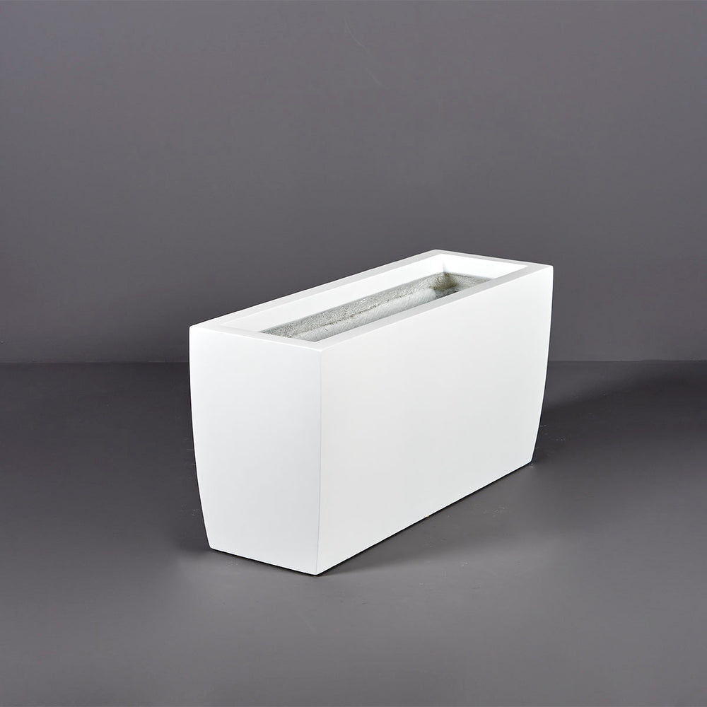 Panama Tapered Rectangle Planter on concrete against gray background.