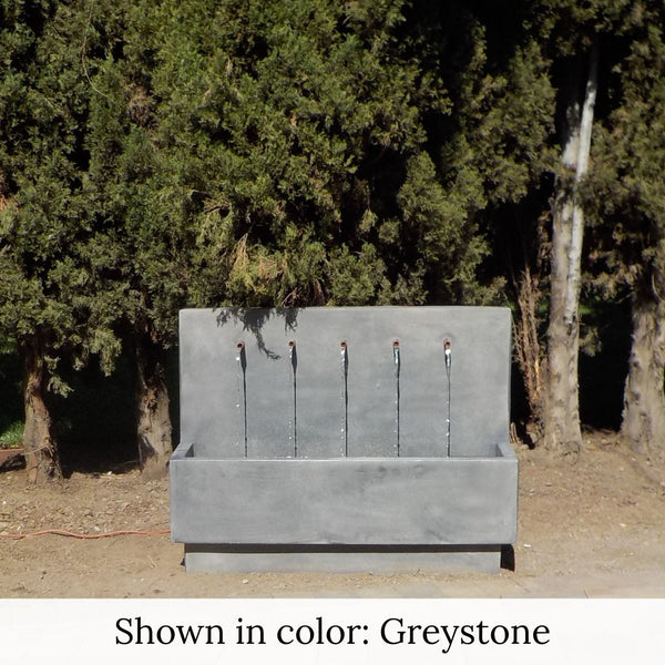 Penta Wall Fountain in greystone color in the backyard.
