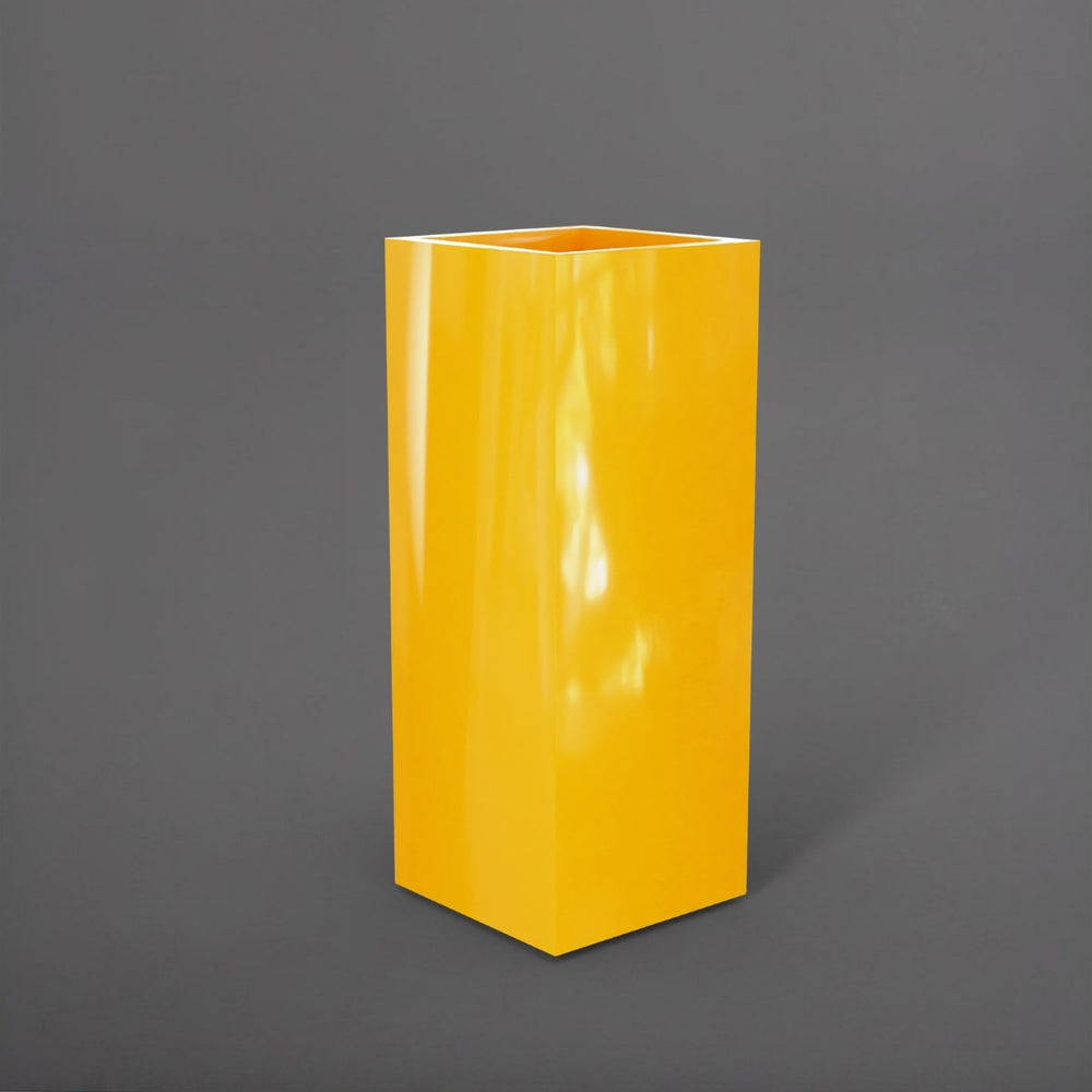 Perth Tall Corner Fiberglass Planter in gloss saffron against gray background.