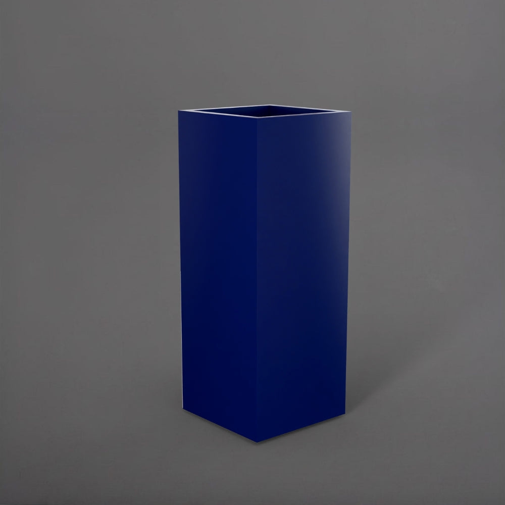 Perth Tall Corner Fiberglass Planter in matte cobalt blue against gray background.