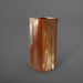 Perth Tall Corner Fiberglass Planter in metallic bronze against gray background.