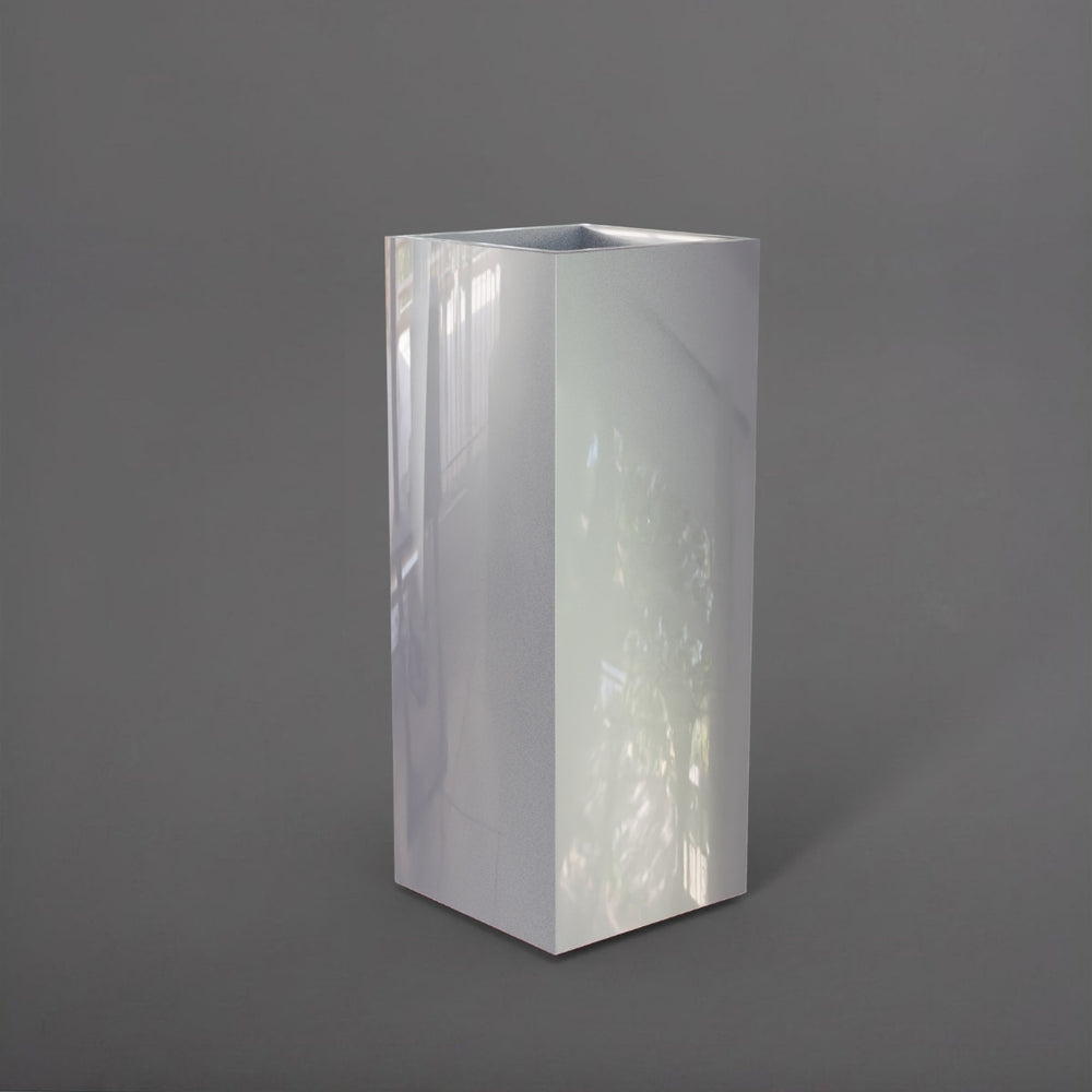 Perth Tall Corner Fiberglass Planter in metallic silver against gray background.