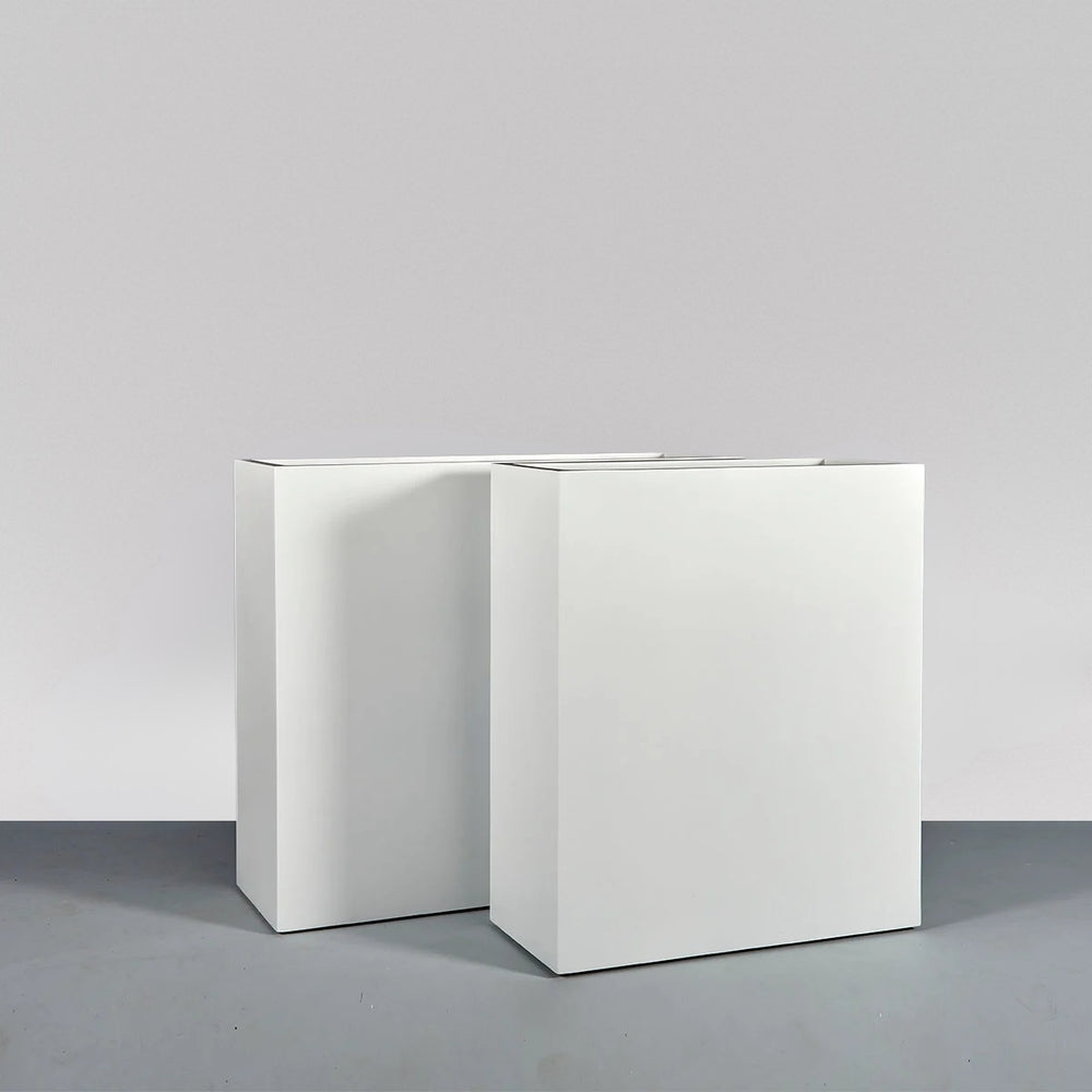 Perth Tall Rectangle Fiberglass Planter on concrete shown with different sizes. 