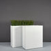 Perth Tall Rectangle Fiberglass Planter shown with different sizes filled with plants.