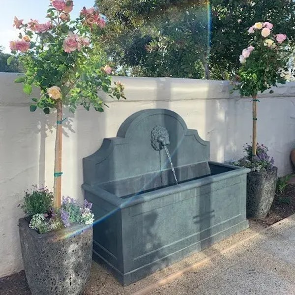 Portofino Fountain beside colorful flowers