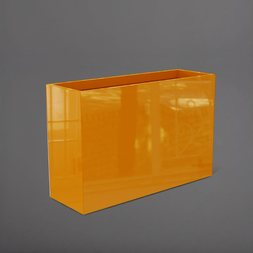 Potsdam Rectangle Fiberglass Planter in gloss tangerine against gray background.