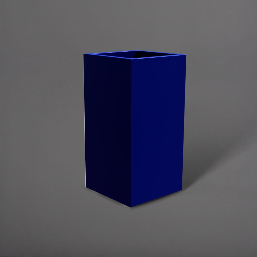 Potsdam Tall Corner Fiberglass Planter in matte cobalt blue against gray background.