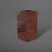 Potsdam Tall Corner Fiberglass Planter in metallic bronze against gray background.