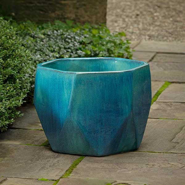 Prism Planter - Aqua on concrete in the backyard