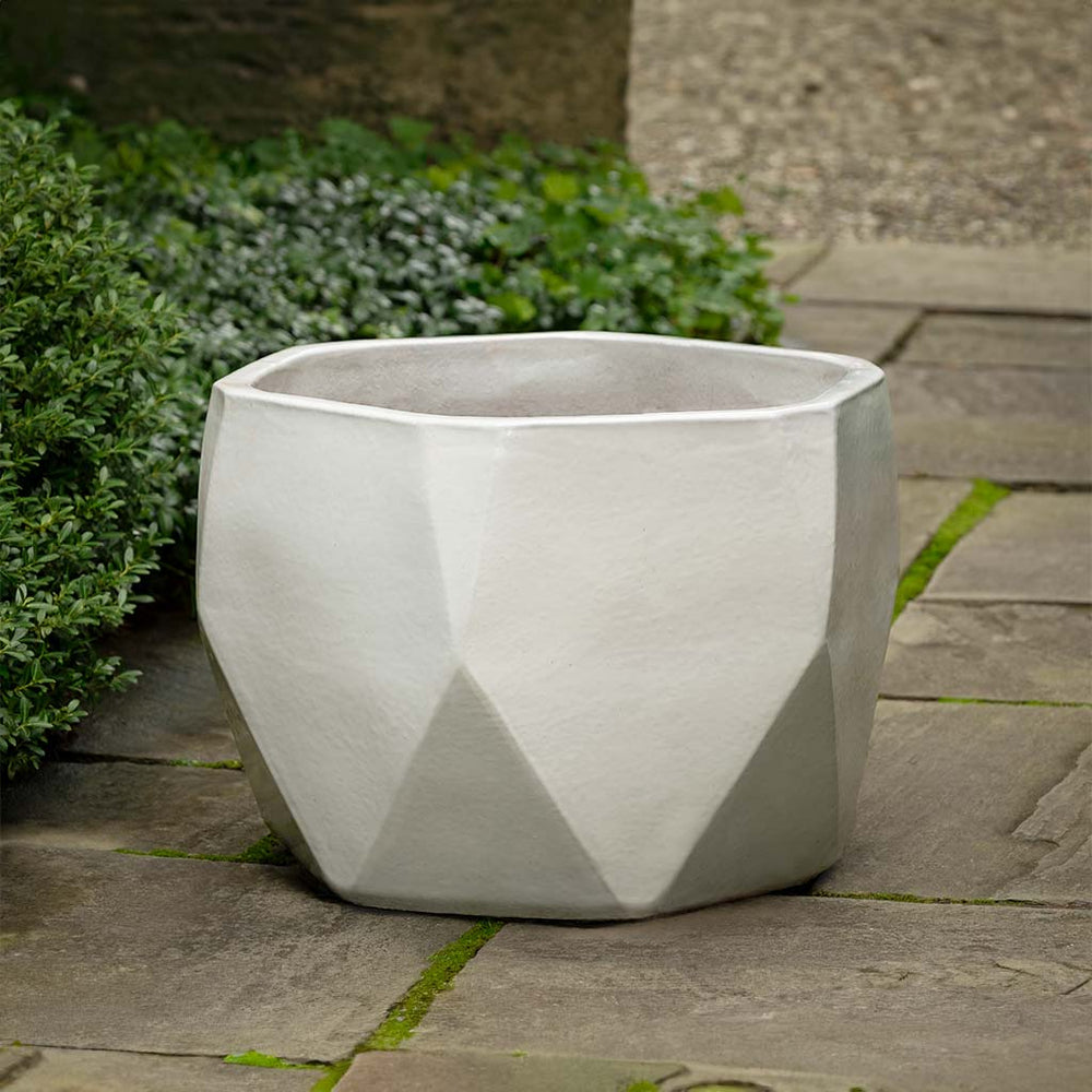 Prism Planter - White on concrete in the backyard.