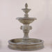 Quatro Lion Two Tier Pond Fountain against gray background.