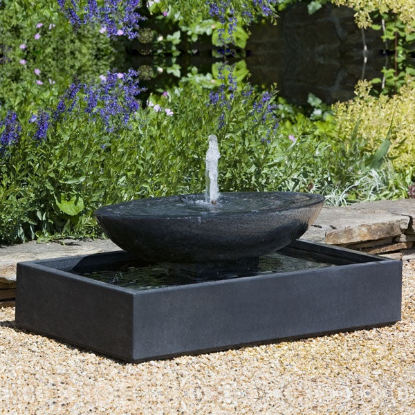 Recife Outdoor Bubbler Water Fountain in action on crushed gravel