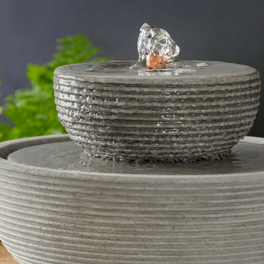 Ribbed Longport Fountain running on the table upclose.