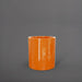 Rio Grande Cylinder Fiberglass Planter in gloss tangerine against gray background.