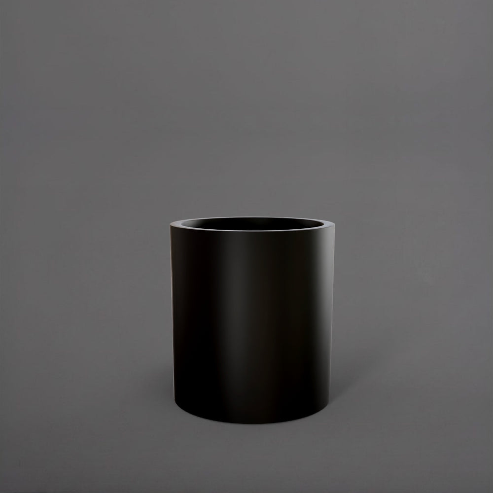 Rio Grande Cylinder Fiberglass Planter in matte black against gray background.