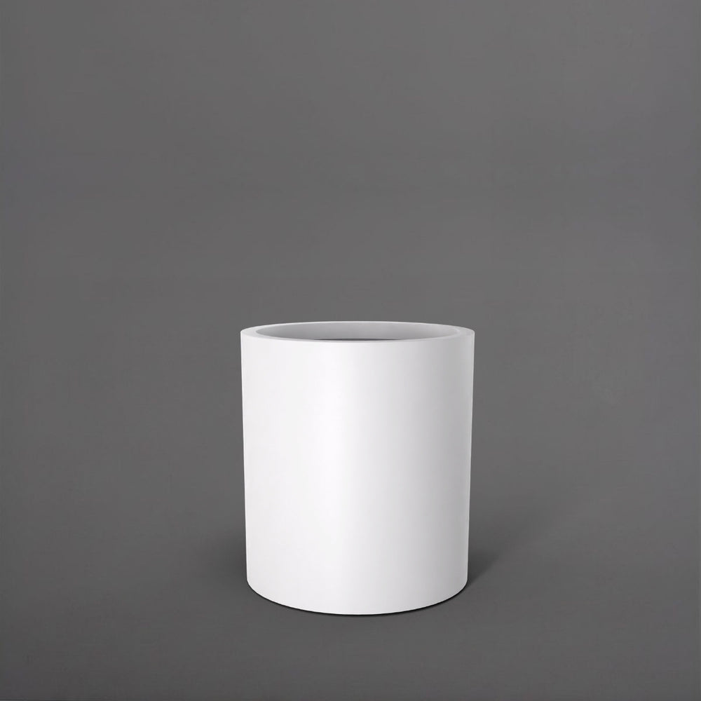 Rio Grande Cylinder Fiberglass Planter in matte bright white against gray background.