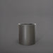 Rio Grande Cylinder Fiberglass Planter in matte gunmetal against gray background.
