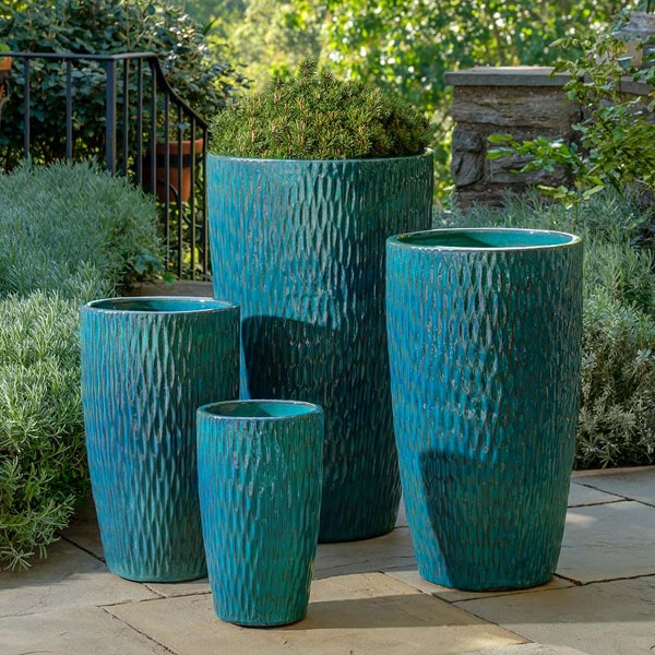 Rivulet Planter - Blue Jade - S/4 on concrete in the backyard