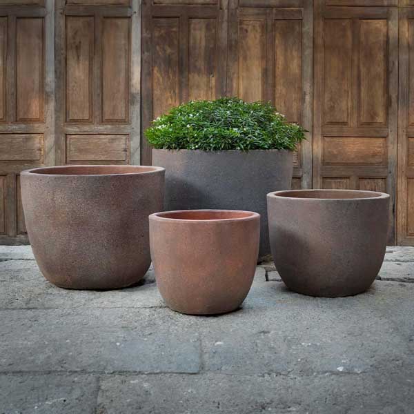 Saba Planter - Sandblasted - S/4 filled with plants in the backyard