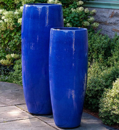 Sabine Planter, Tall - Riviera Blue - S/1 on concrete in the backyard.a
