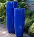 Sabine Planter, Tall - Riviera Blue - S/1 on concrete in the backyard.a