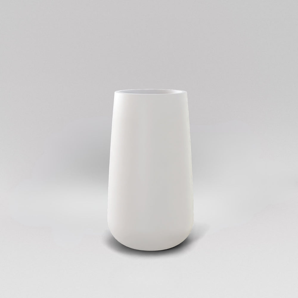 Saigon Tapered Round Fiberglass Planter in matte bright white against gray background.
