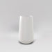 Saigon Tapered Round Fiberglass Planter in matte bright white against gray background.