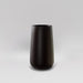 Saigon Tapered Round Fiberglass Planter in matte charcoal against gray background.