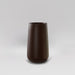 Saigon Tapered Round Fiberglass Planter in matte dark brown against gray background.