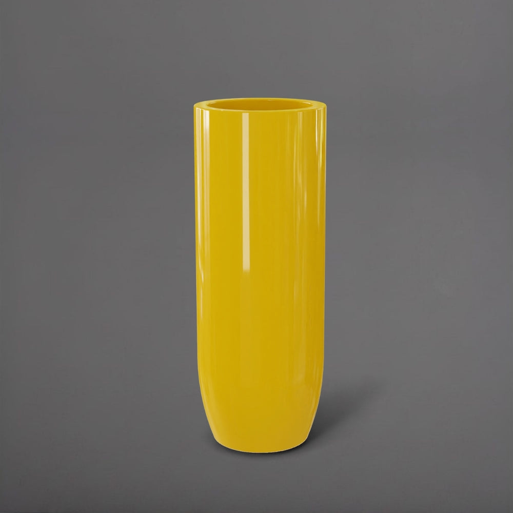 Saint Tropez Tall Bullet Round Fiberglass Planter in gloss saffron against gray background.