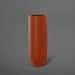 Saint Tropez Tall Bullet Round Fiberglass Planter in matte terra cotta against gray background.
