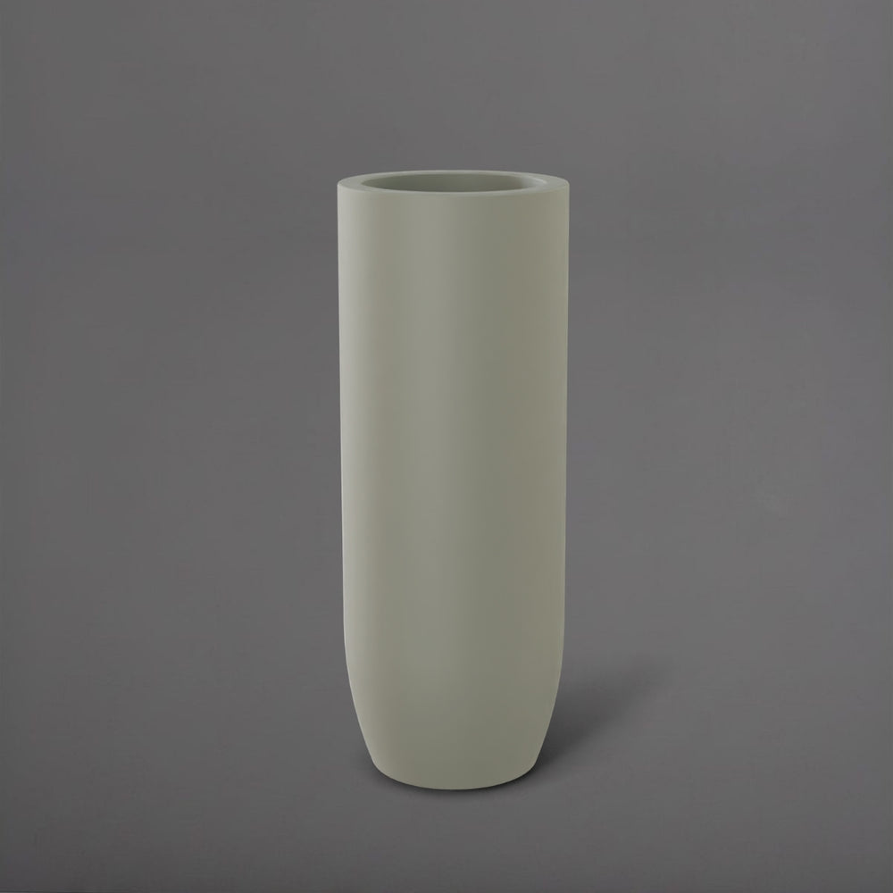 Saint Tropez Tall Bullet Round Fiberglass Planter in satin beige against gray background.