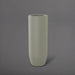 Saint Tropez Tall Bullet Round Fiberglass Planter in satin beige against gray background.