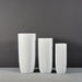 Saint Tropez Tall Bullet Round Fiberglass Planter shown with different sizes.